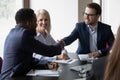 Smiling male partners handshake greeting at office meeting Royalty Free Stock Photo