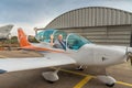 Smiling male pilot in the light aircraft cockpit. Elderly man learns to drive a light airplane. Pilot training course Royalty Free Stock Photo