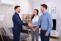 Real Estate Agent Shaking Hands With His Clients Royalty Free Stock Photo