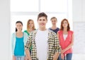 Smiling male student with group of classmates