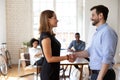 Smiling male team leader shaking hands with employee. Royalty Free Stock Photo