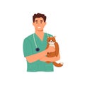 Smiling male veterinarian doctor holding a cat