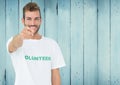 Smiling male volunteer pointing at camera Royalty Free Stock Photo