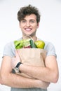 Smiling man with bag full of groceries Royalty Free Stock Photo