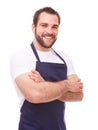 Smiling man in blue apron Royalty Free Stock Photo