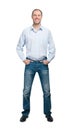 Smiling man in blue shirt and jeanse isolated on white background Royalty Free Stock Photo