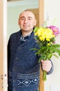 Smiling man with bouquet Royalty Free Stock Photo