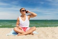 Smiling man calling on smartphone on summer beach Royalty Free Stock Photo