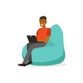 Smiling man casual dressing, sitting on bean bag chair and working with laptop, coworking space vector Illustration Royalty Free Stock Photo