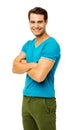 Smiling Man In Casuals Standing Arms Crossed