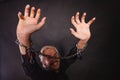 Smiling man with chained hands, no freedom Royalty Free Stock Photo