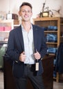 Smiling man customer searching new suit Royalty Free Stock Photo