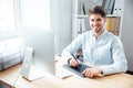 Smiling man designer working and using graphic tablet in office Royalty Free Stock Photo