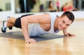 Smiling man doing push-ups in the gym Royalty Free Stock Photo