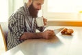 Smiling man drinking coffee with tablet Royalty Free Stock Photo