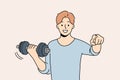 Man with dumbbell point at screen