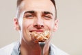 Smiling man eating cake. Royalty Free Stock Photo