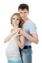 Smiling man embracing happy pregnant woman. isolat Royalty Free Stock Photo