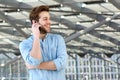 Smiling man enjoying conversation on cell phone Royalty Free Stock Photo