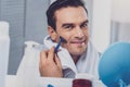 Smiling man feeling relaxed after taking shower