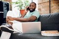 Smiling man with gadgets and tasty pizza stock photo