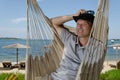 Smiling man in gomak with sea in background