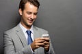 A smiling man with a handphone isolated Royalty Free Stock Photo