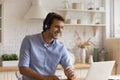 Smiling man in headphones watch webinar on laptop Royalty Free Stock Photo