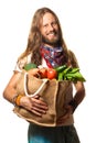 Smiling man holding a bag of fruit and vegetables. Royalty Free Stock Photo