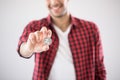 Smiling man holding silver coin of litecoin - symbol of virtual Royalty Free Stock Photo