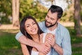 Smiling man hugging happy wife outdoors Royalty Free Stock Photo