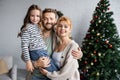 Smiling man hugging wife and daughter Royalty Free Stock Photo