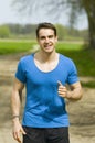 Smiling man jogging