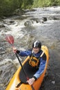 Smiling Man kayaking in river