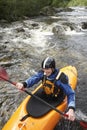 Smiling Man kayaking in river