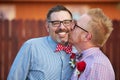 Smiling Man Kissed By Spouse Royalty Free Stock Photo