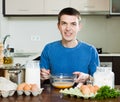 Smiling man in kitchen Royalty Free Stock Photo