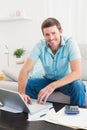 Smiling man on a laptop at home Royalty Free Stock Photo