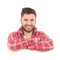 Smiling man in lumberjack shirt lean on a banner