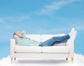 Smiling man lying on sofa Royalty Free Stock Photo