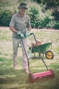 Smiling man mowing lawn Royalty Free Stock Photo