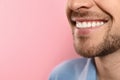 Smiling man with perfect teeth on color background. Space for text Royalty Free Stock Photo