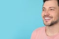 Smiling man with perfect teeth on color background. Royalty Free Stock Photo