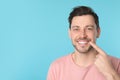 Smiling man with perfect teeth on color background. Royalty Free Stock Photo