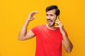 Smiling man phone studio cyberspace communication happy portrait space yellow smartphone copy mobile phone Royalty Free Stock Photo