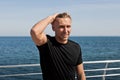 Smiling man posing on pier Royalty Free Stock Photo