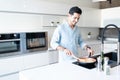 Smiling Man Preparing Pasta At Home Royalty Free Stock Photo