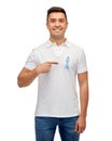 Smiling man with prostate cancer awareness ribbon