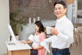 Smiling man reading newspaper and having coffee Royalty Free Stock Photo