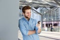 Smiling man reading text message on mobile phone Royalty Free Stock Photo